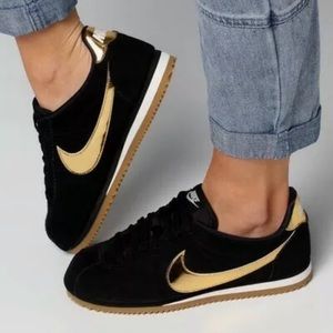 nike black & gold cortez suede trainers